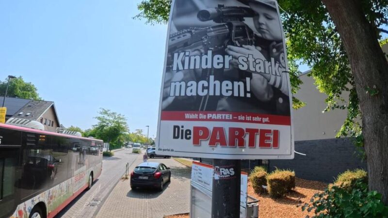Kommunalwahl 2025 in Leverkusen: Hitdorfer kritisiert Parteiwerbung mit Kind und Gewehr vor Kita